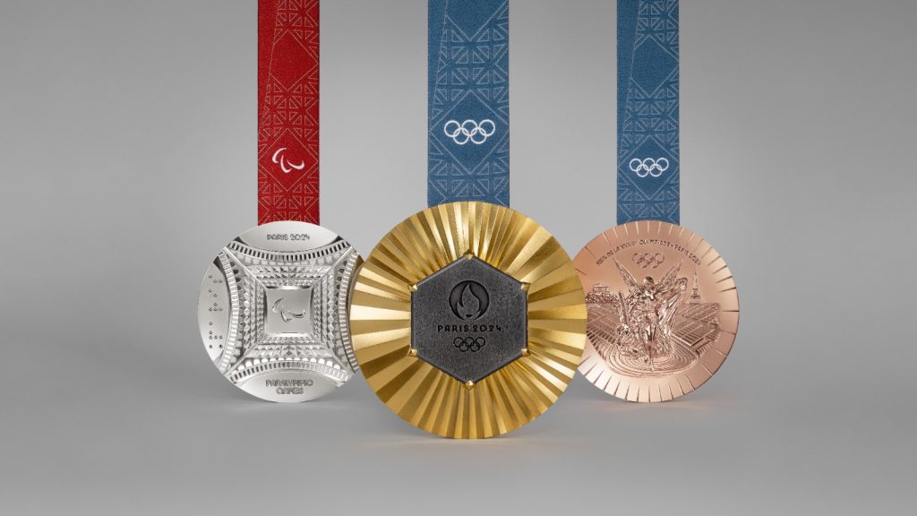 The gold Olympic medal (centre), features a fragment from the Eiffel Tower. Photo: Paris 2024 Olympic Games Organising Committee