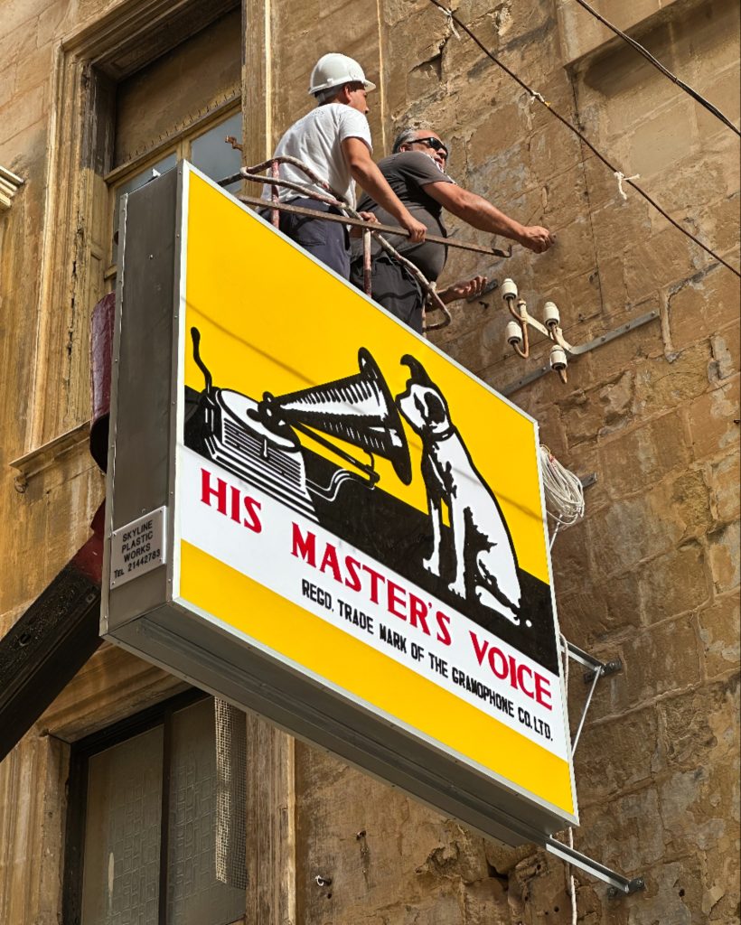 A replica of the original HMV sign installed outside. Photo: D'Amato Records