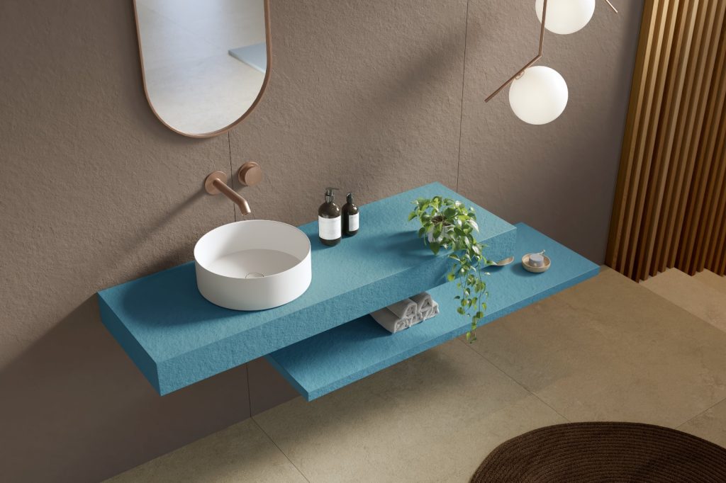 blue bathroom countertop with stand alone basin