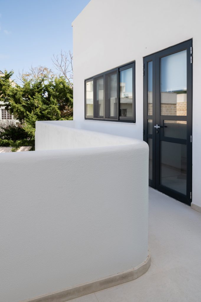 exterior staircase and roof access with black apertures