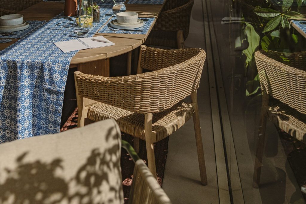 Pola collection by Kave Home paired with Maduma's Blu Ċar table runner / Photography by Brian Grech