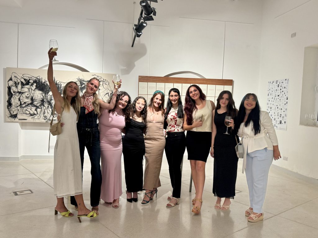Charlene Vella with this year's cohort of Fine Arts students at their thesis project exhibition