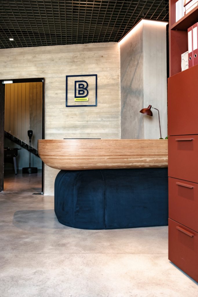 The bespoke reception desk serves two functions: welcome visitors with impact and set the tone for the rest of the office / Photography: Brian Grech
