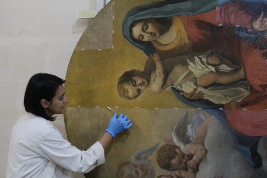Founder & Conservation Director Amy Sciberras carrying out chromatic integration of infilled losses using reversible varnish colours / Photo by ASC Conservation Centre Ltd